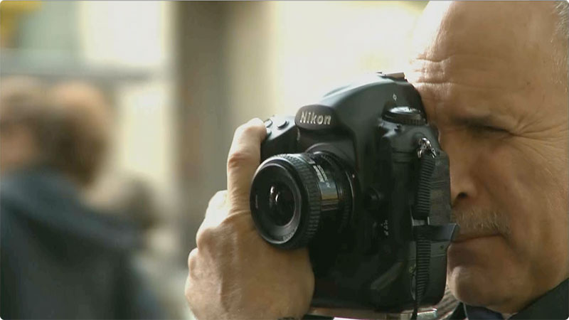 CLOSE UP PHOTOGRAPHERS AT WORK